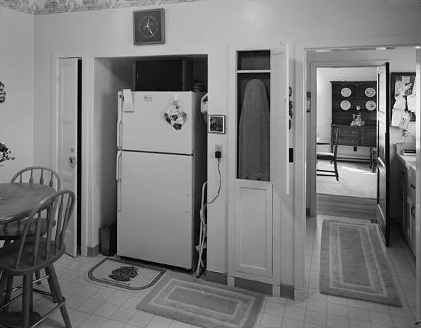 KITCHEN: TWIN CLOSETS FLANKING REFRIGERATOR