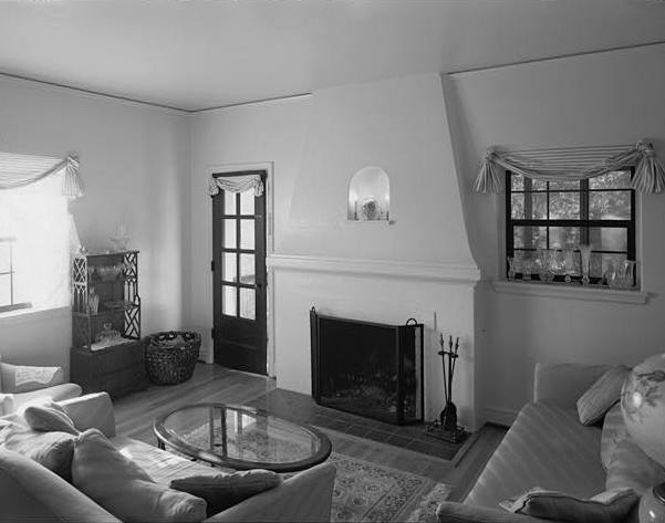 LIVING ROOM, WITH FIREPLACE, LOOKING SOUTH TO SCREENED PORCH DOORWAY