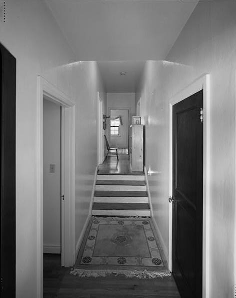 LOOKING NORTHWEST FROM LIVING ROOM DOORWAY THROUGH HALL TOWARD MASTER BEDROOM