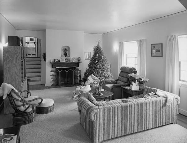 LIVING ROOM, FIREPLACE, AND STAIR TO BEDROOMS