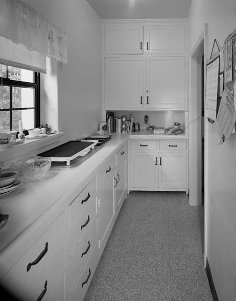 BUTLER'S PANTRY FROM DINING ROOM DOORWAY. KITCHEN DOORWAY IS AT RIGHT